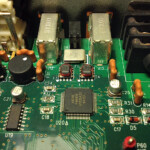 No, this is not a model of the futuristic city, Thrakkorzog. This is the inside of my Digi 002 audio interface. That square guy "Agere" in the middle unfortunately joined the choir invisible just before this photo. Winter 2013. No, this is not a model of the futuristic city, Thrakkorzog. This is the inside of my Digi 002 audio interface. That square guy "Agere" in the middle unfortunately joined the choir invisible just before this photo. Winter 2013.